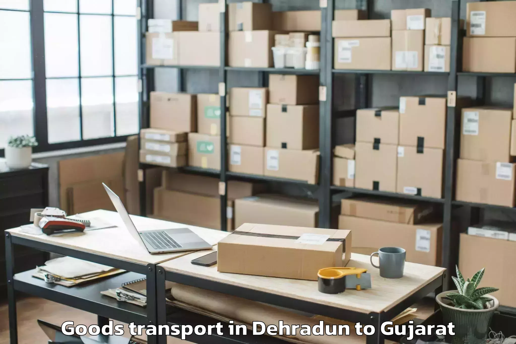 Professional Dehradun to Songadh Goods Transport